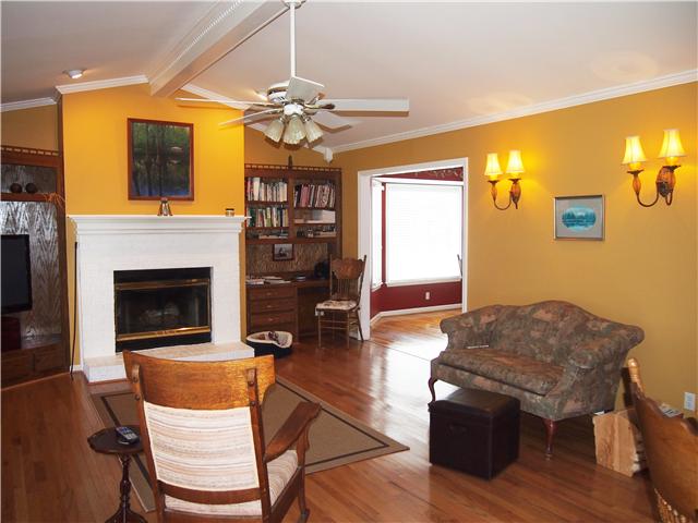 2848 Bolton Road Columbia, TN 38401 - Photo 5 of 20 a living room with furniture a fireplace and a flat screen tv