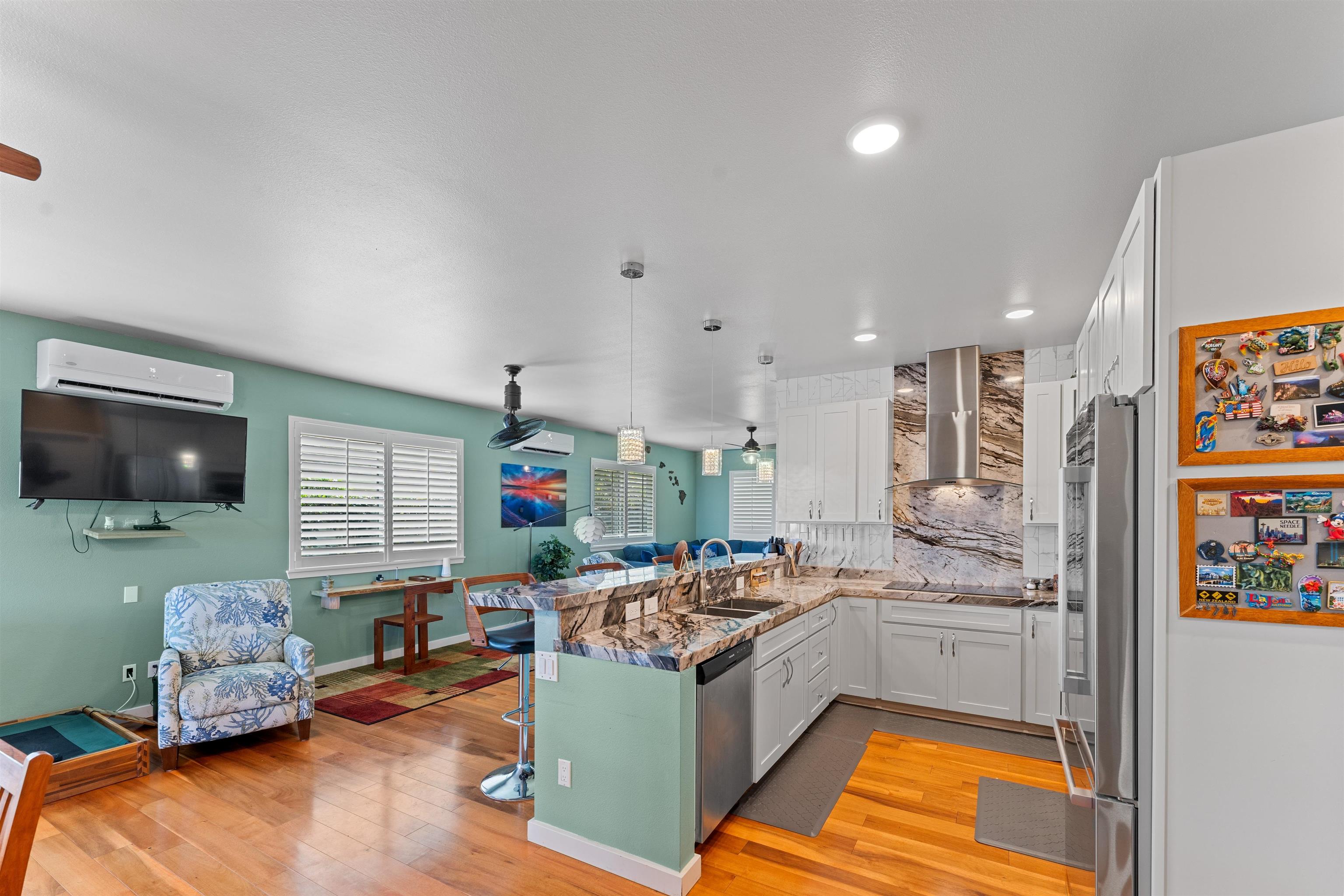 112 Kili'o'opu Street Wailuku, HI 96793 - Photo 11 of 49 a open kitchen with stainless steel appliances granite countertop a stove and a sink
