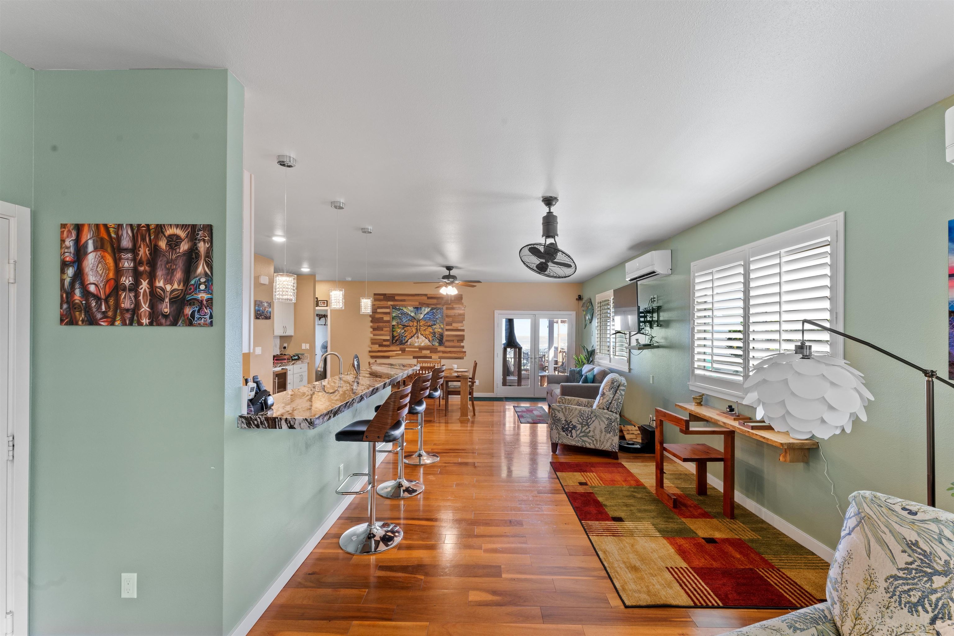 112 Kili'o'opu Street Wailuku, HI 96793 - Photo 18 of 49 a room with lots of furniture and windows