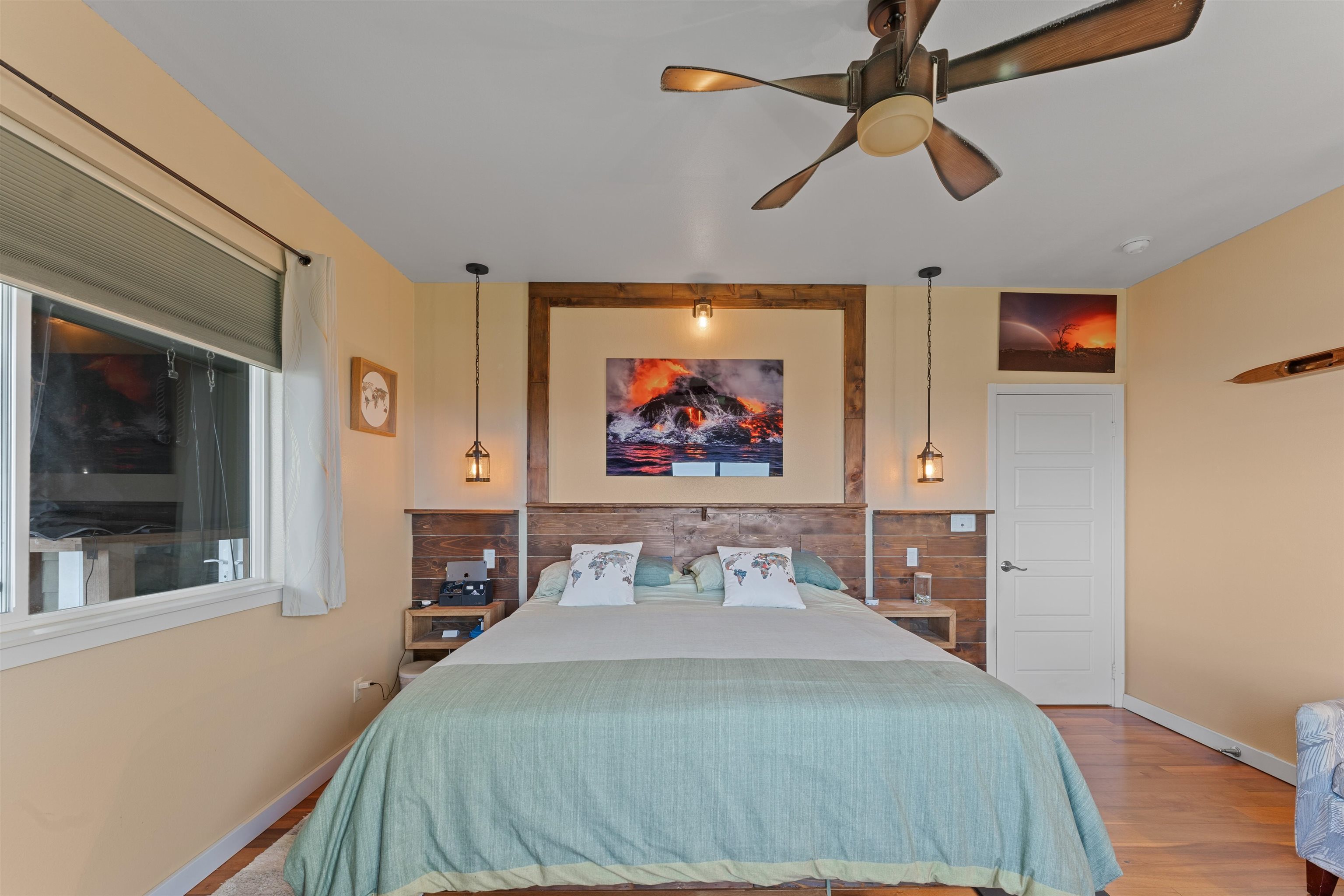 112 Kili'o'opu Street Wailuku, HI 96793 - Photo 22 of 49 a bedroom with a bed and a painting on the wall
