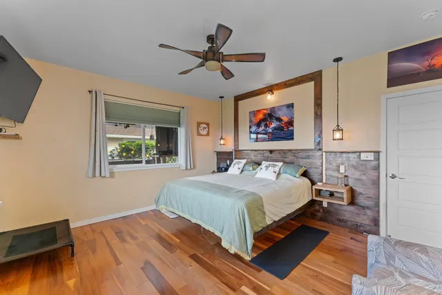 a bedroom with bed and window