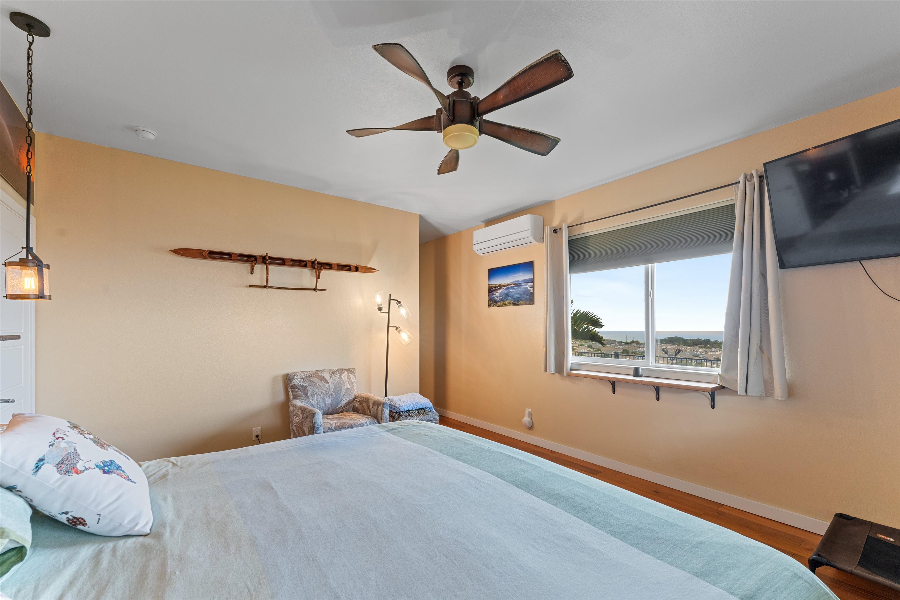112 Kili'o'opu Street Wailuku, HI 96793 - Photo 25 of 49 a bedroom with a bed and window