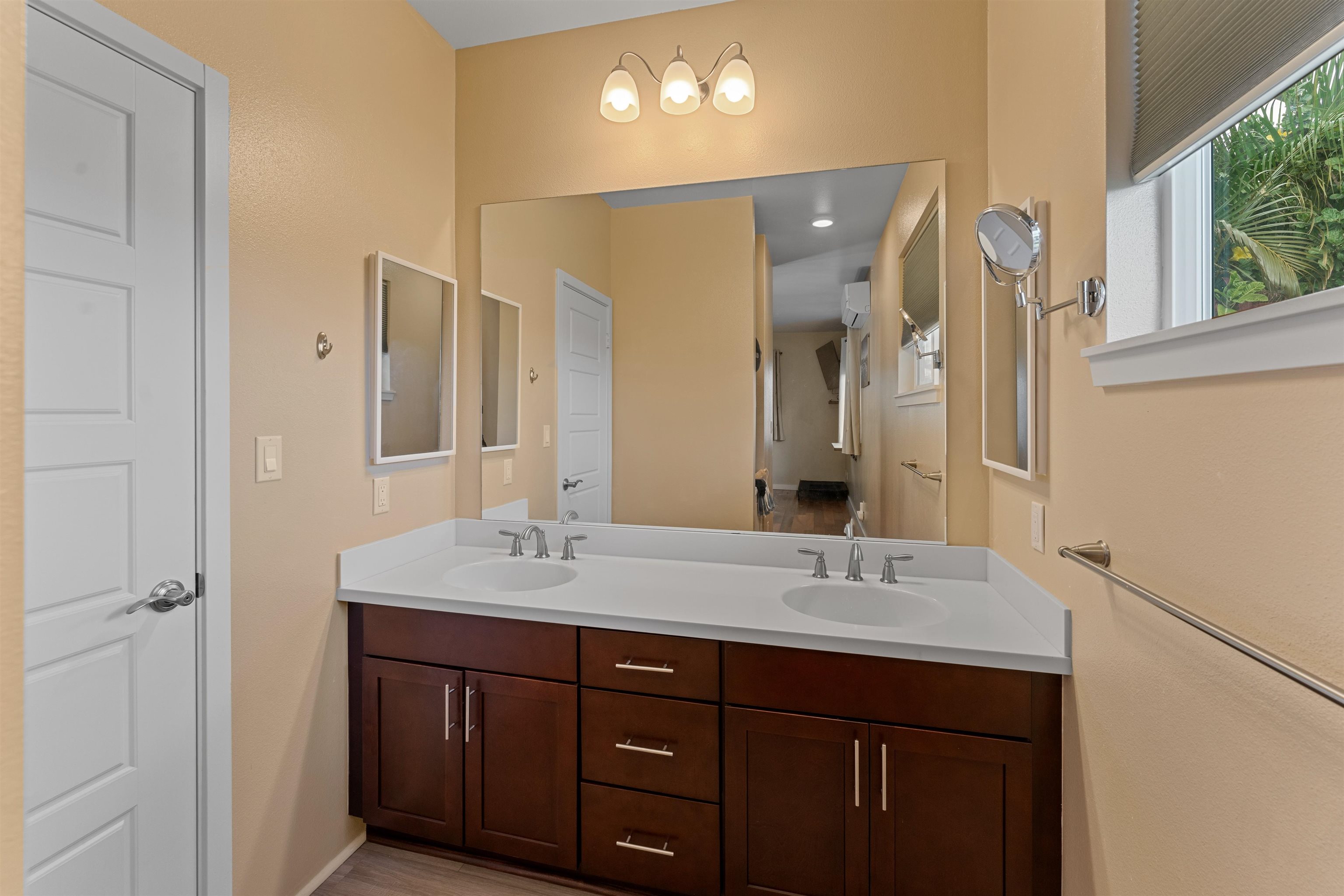 112 Kili'o'opu Street Wailuku, HI 96793 - Photo 26 of 49 a bathroom with a double vanity sink and a mirror