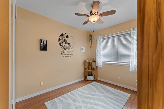 a view of room with window and wooden floor