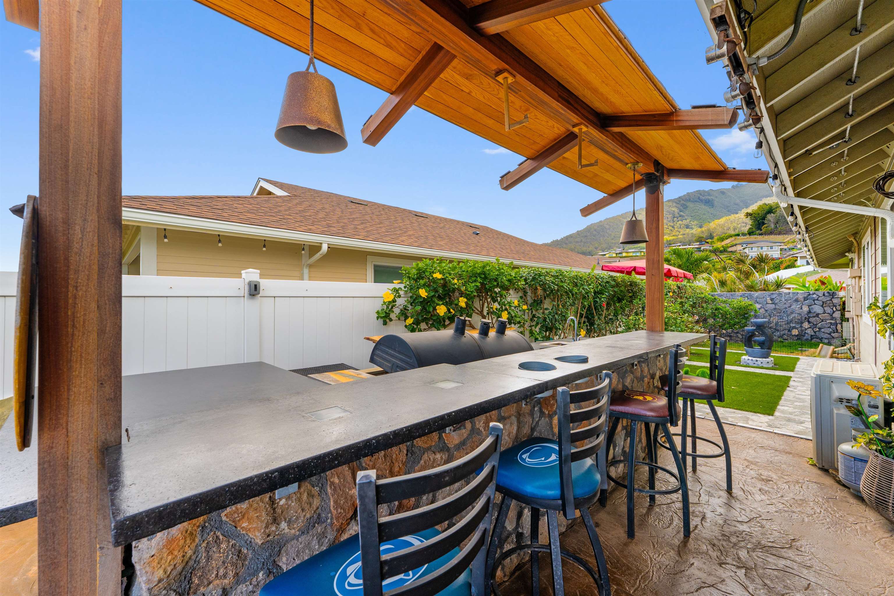 112 Kili'o'opu Street Wailuku, HI 96793 - Photo 35 of 49 a view of an outdoor sitting area with swimming pool