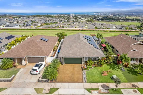 an aerial view of a house with a lake view