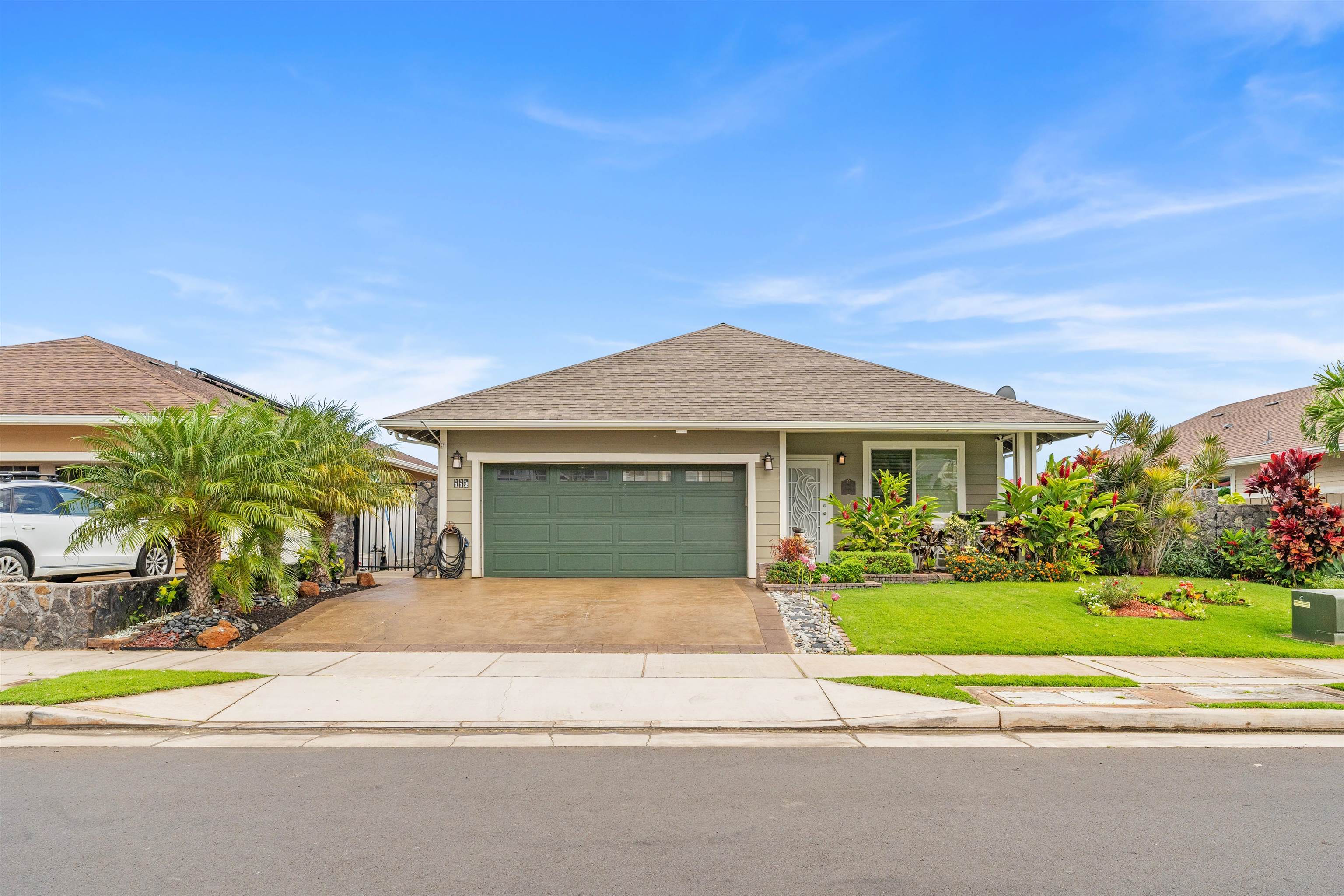112 Kili'o'opu Street Wailuku, HI 96793 - Photo 45 of 49 a view of a house with a yard and palm trees