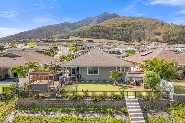 a view of house with outdoor space swimming pool and mountains
