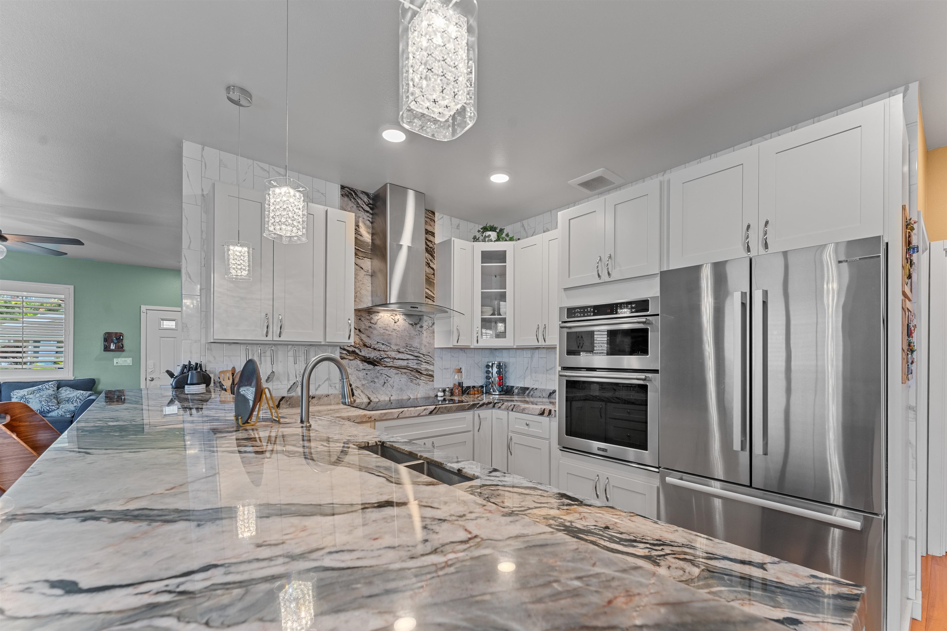 112 Kili'o'opu Street Wailuku, HI 96793 - Photo 6 of 49 a kitchen with stainless steel appliances granite countertop a sink refrigerator and cabinets