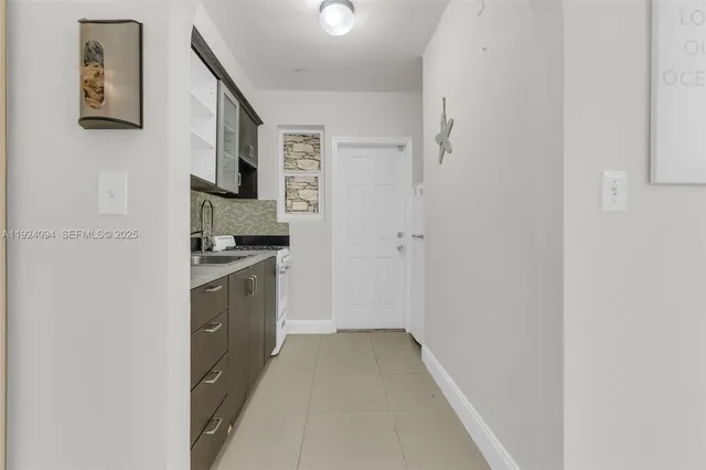a view of a kitchen with a sink and dishwasher