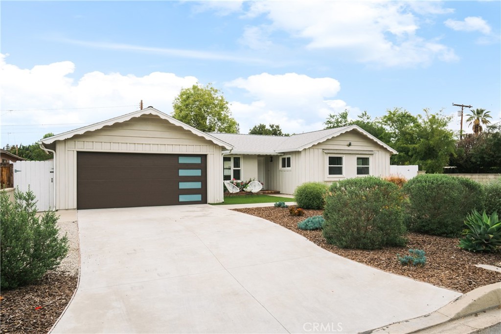 165 West Palm Drive Arcadia, CA 91007 - Photo 1 of 30 a front view of a house with a yard and garage