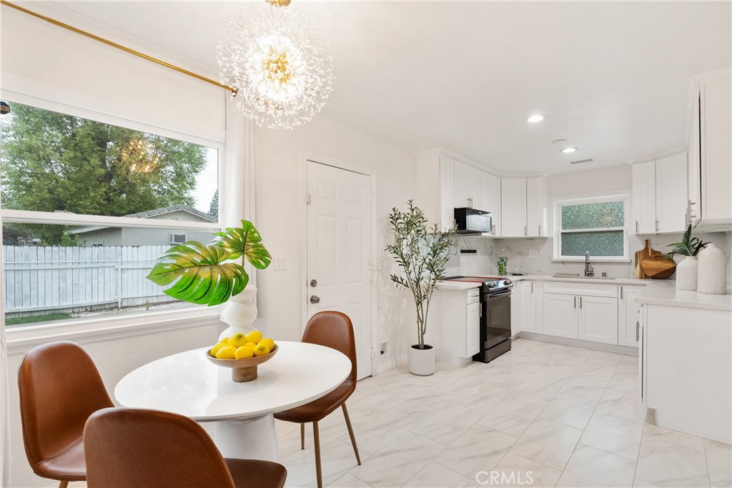165 West Palm Drive Arcadia, CA 91007 - Photo 12 of 30 a kitchen with a table and chairs in it