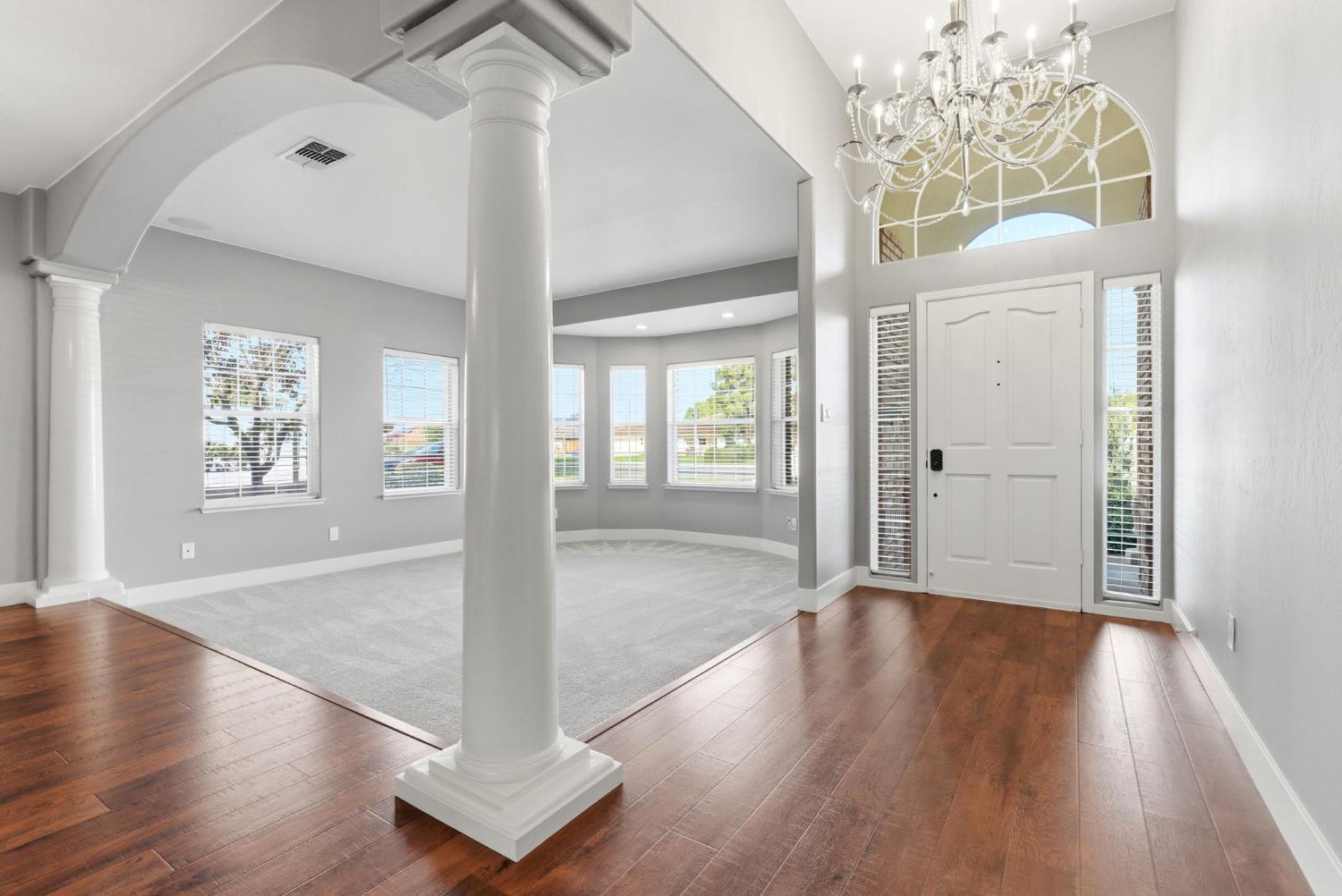 13201 Meacham Road Bakersfield, CA 93314 - Photo 11 of 62 a view of a hallway with wooden floor and a living room