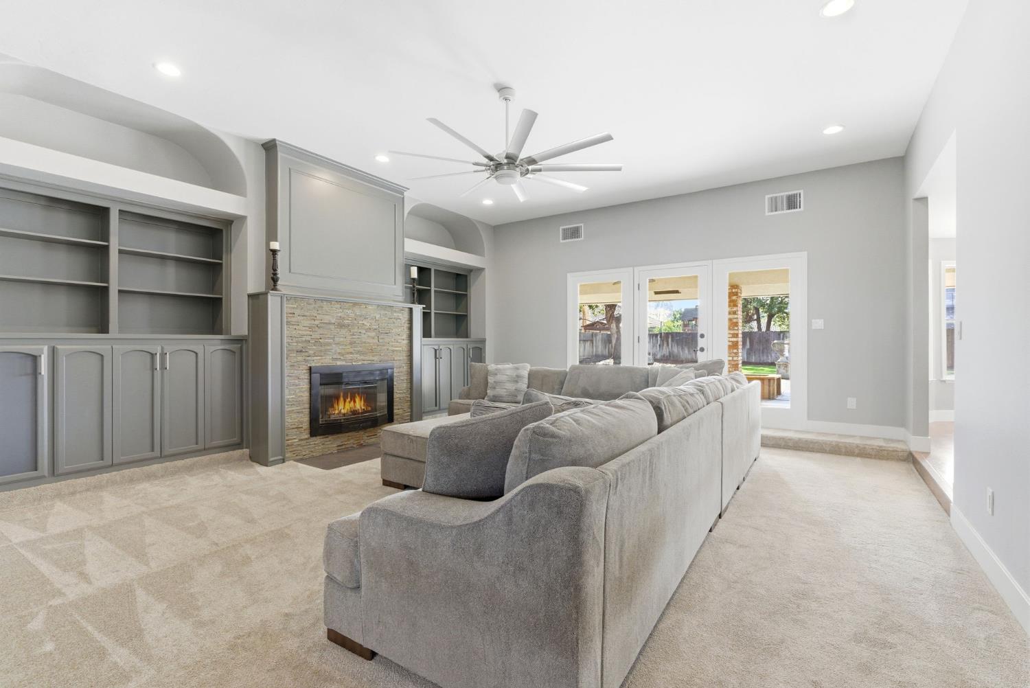 13201 Meacham Road Bakersfield, CA 93314 - Photo 20 of 62 a living room with furniture and a fireplace