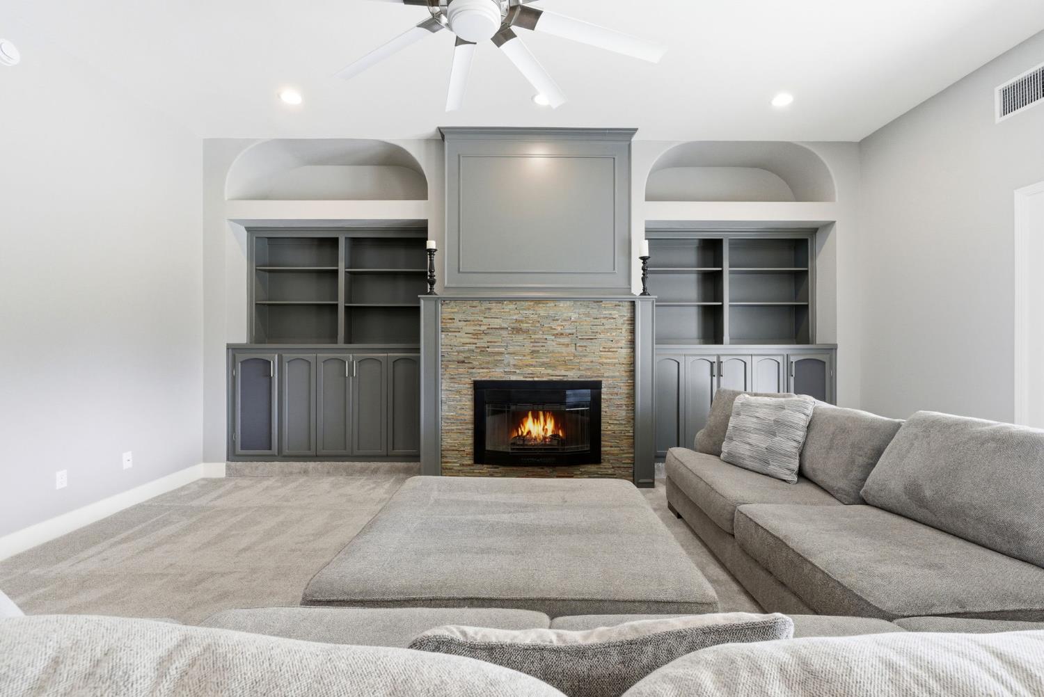 13201 Meacham Road Bakersfield, CA 93314 - Photo 24 of 62 a living room with furniture and a fireplace