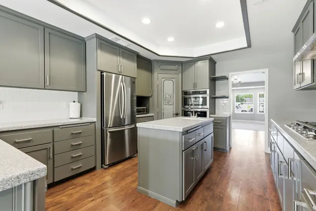 a bedroom with a bed and a chair