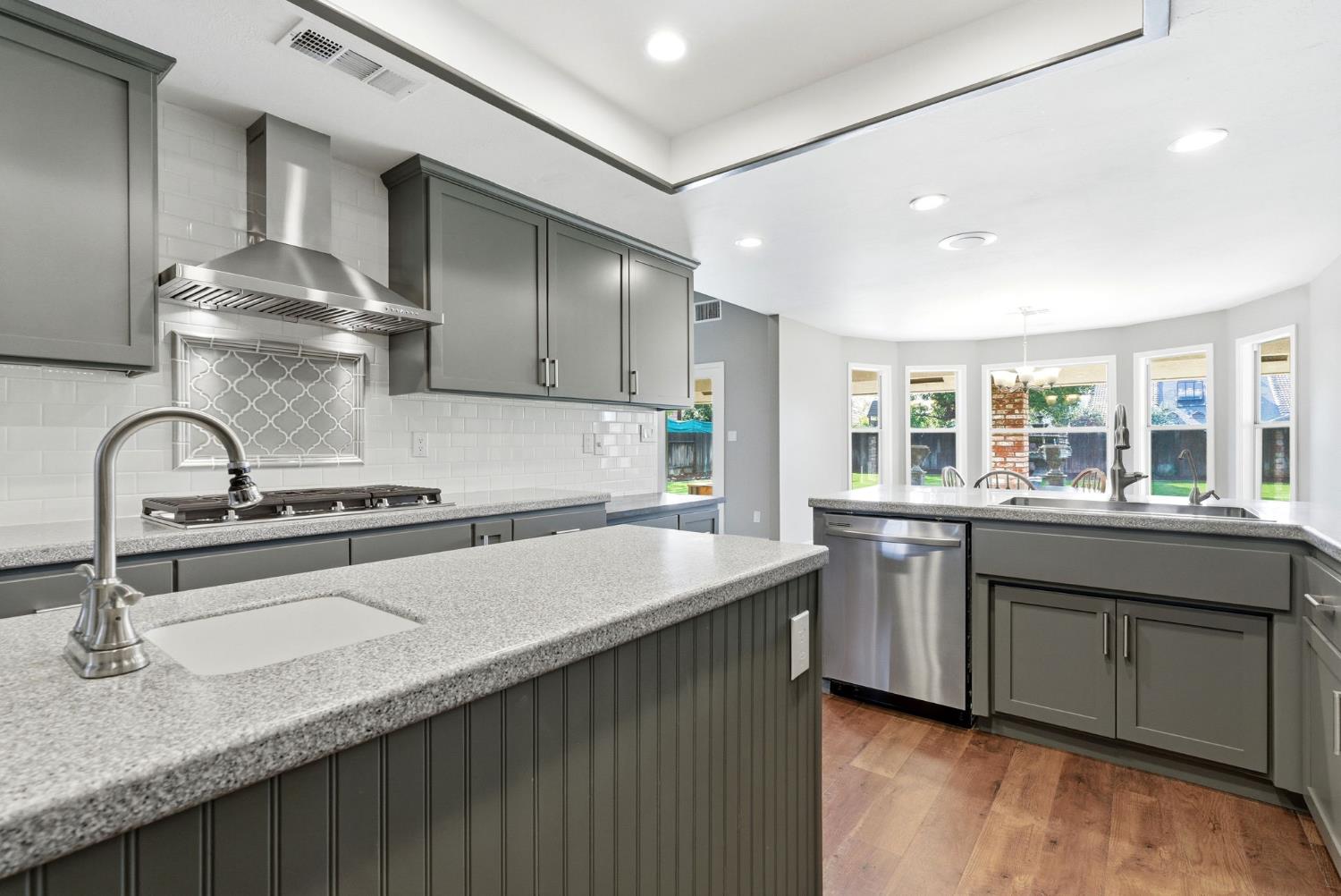 13201 Meacham Road Bakersfield, CA 93314 - Photo 30 of 62 a kitchen with granite countertop a sink and cabinets