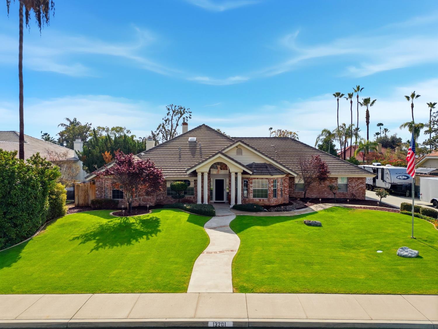 13201 Meacham Road Bakersfield, CA 93314 - Photo 3 of 62 a house view with a garden space