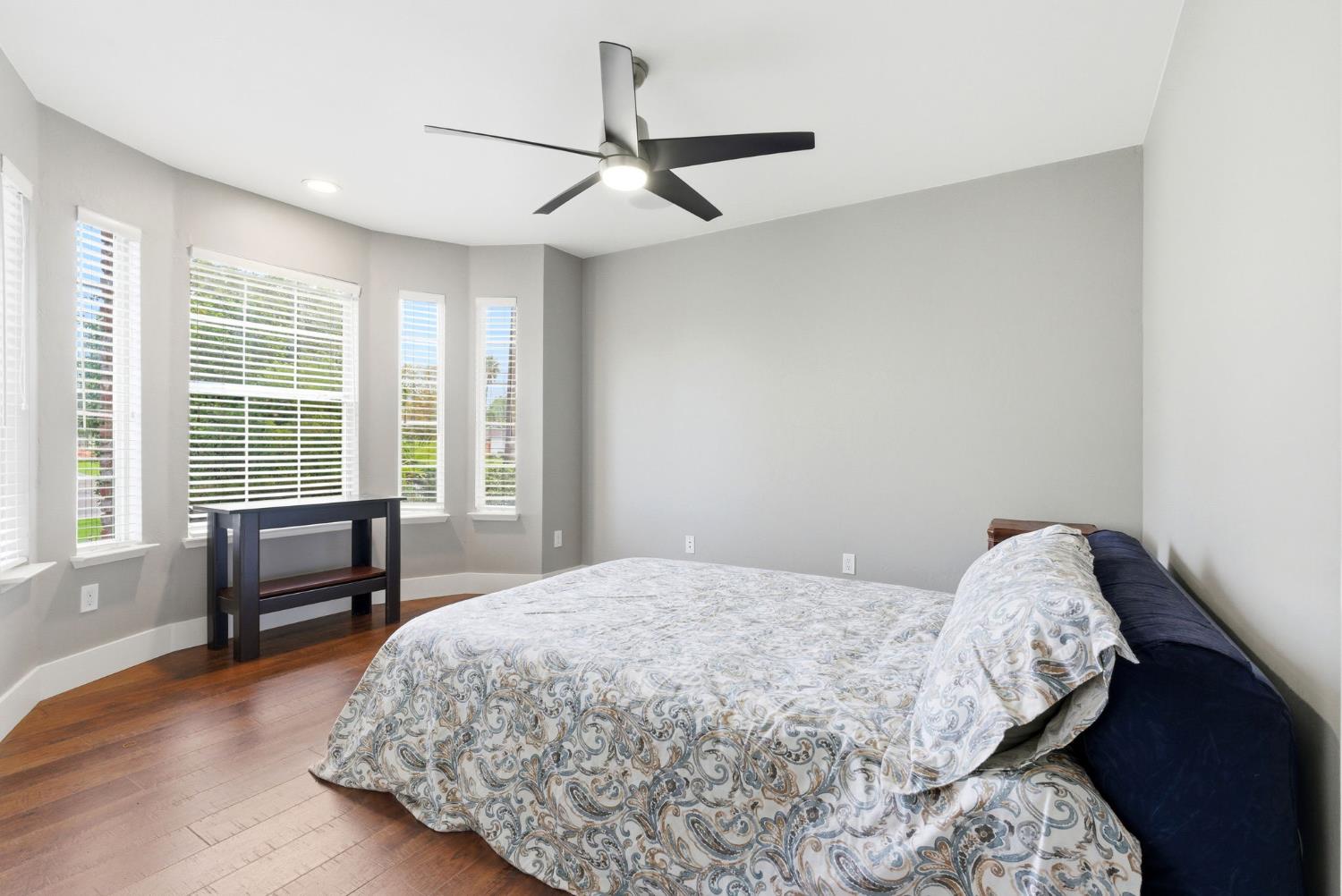 13201 Meacham Road Bakersfield, CA 93314 - Photo 35 of 62 a bedroom with a bed and a chair