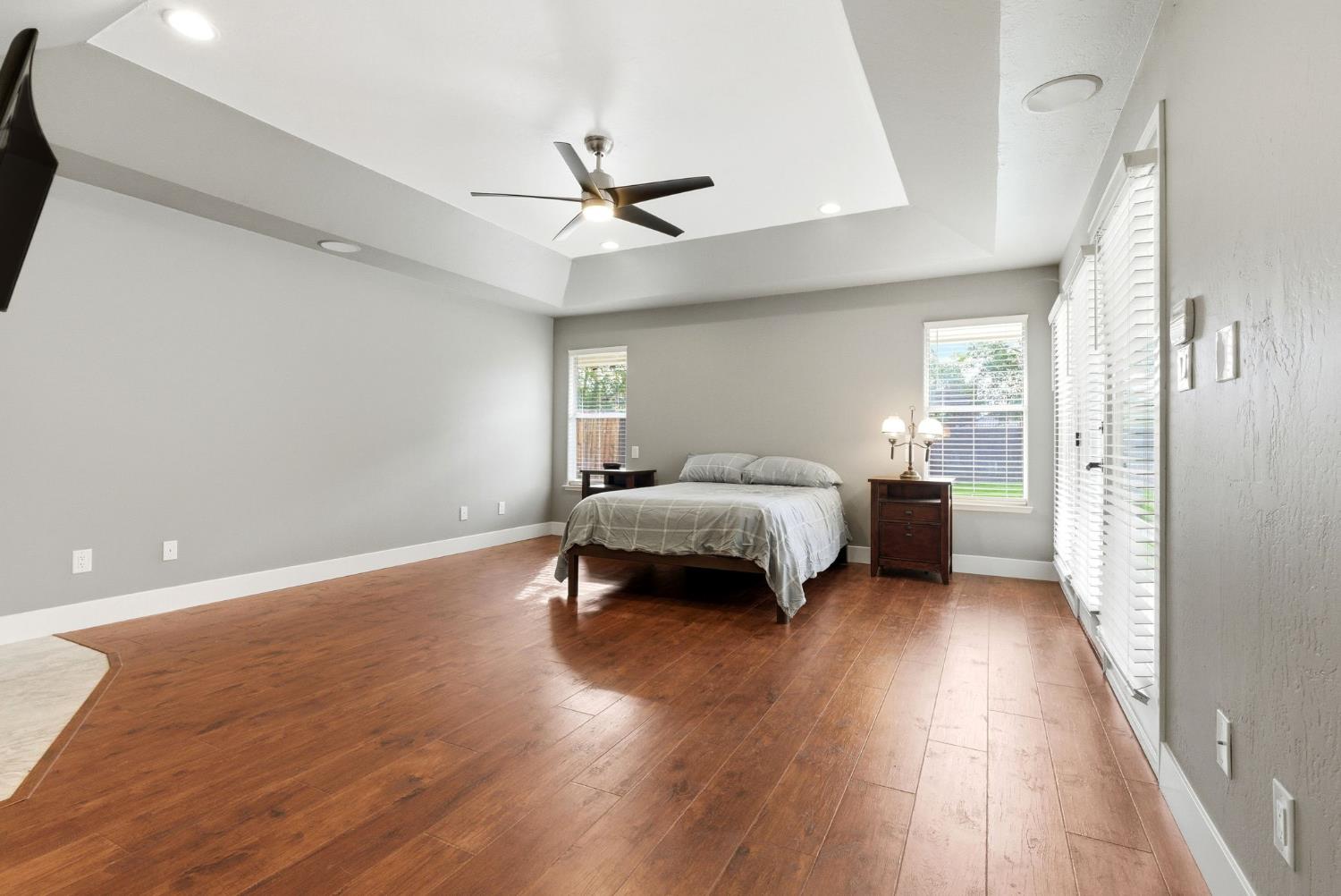 13201 Meacham Road Bakersfield, CA 93314 - Photo 45 of 62 a bedroom with a bed and a chandelier