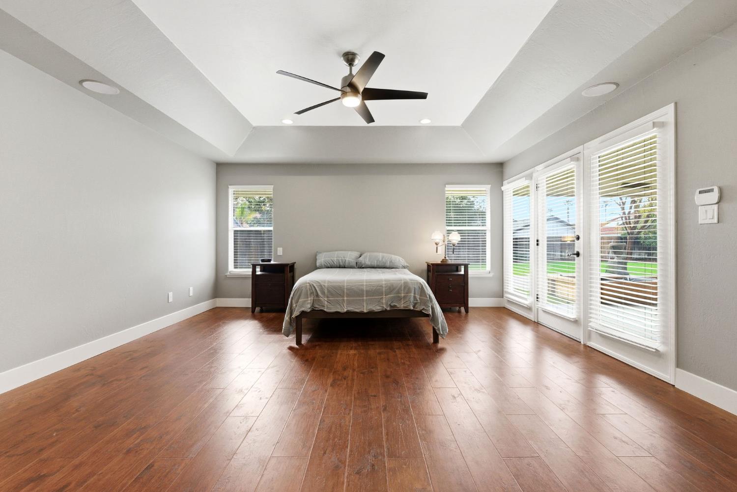 13201 Meacham Road Bakersfield, CA 93314 - Photo 48 of 62 a bedroom with a bed and wooden floor