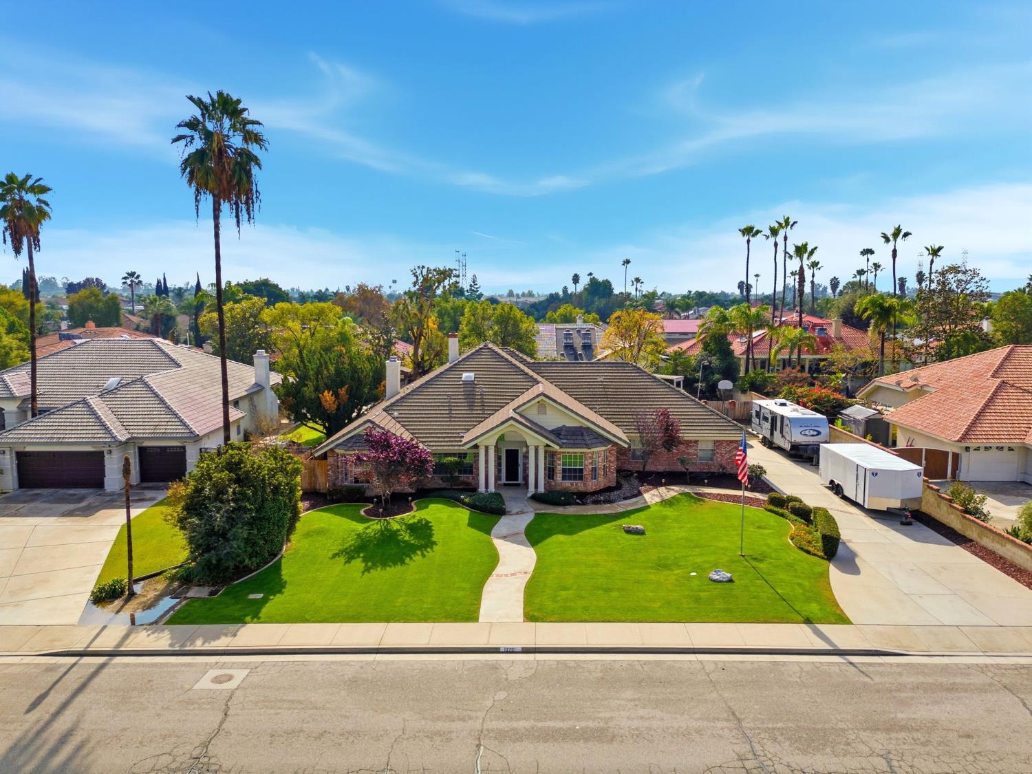 13201 Meacham Road Bakersfield, CA 93314 - Photo 5 of 62 a view of multiple houses with a yard and potted plants