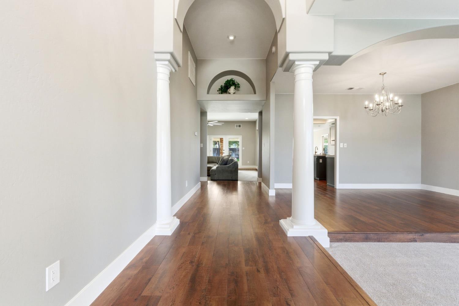 13201 Meacham Road Bakersfield, CA 93314 - Photo 10 of 62 a view of a hallway with wooden floor windows and a bathroom