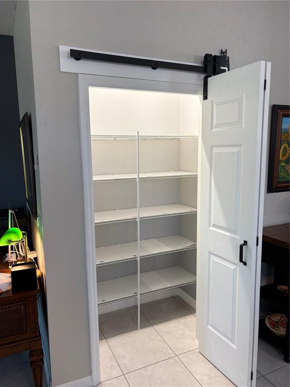7819 Southwest 88th St Road Ocala, FL 34476 - Photo 11 of 30 a view of walk in closet with empty racks