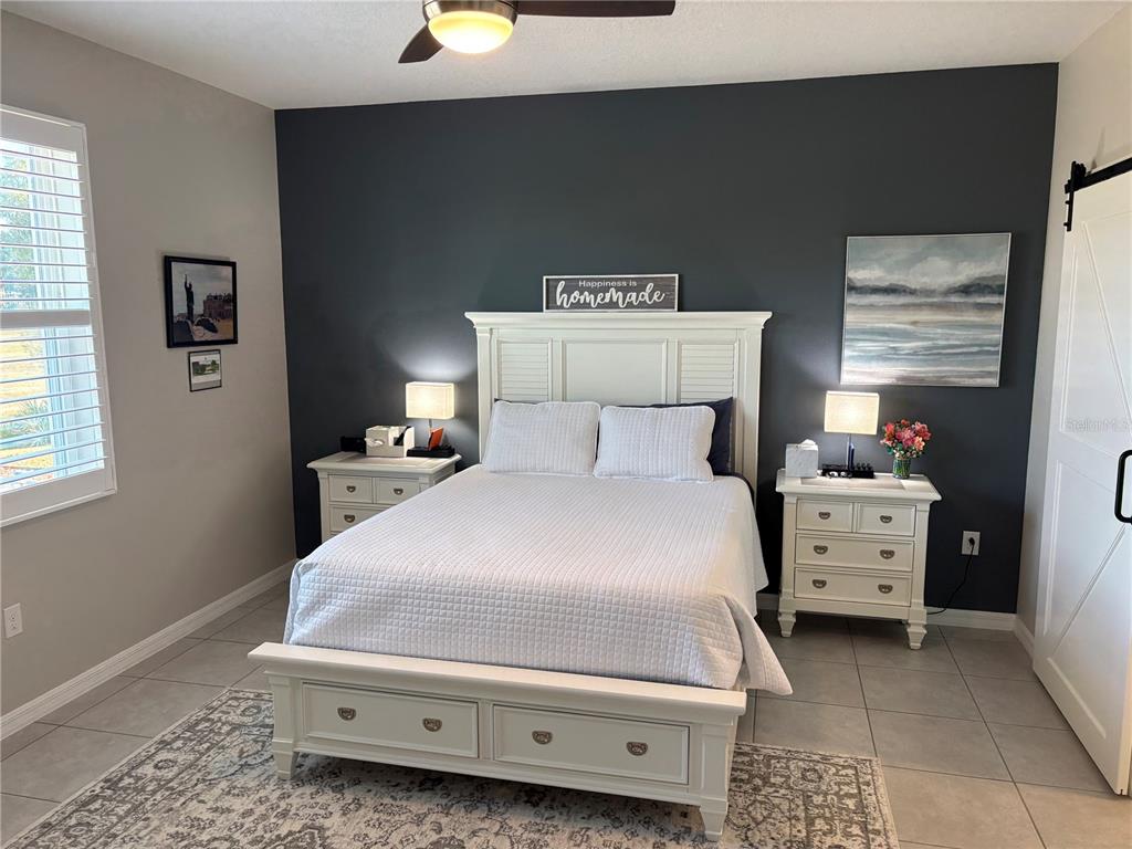 7819 Southwest 88th St Road Ocala, FL 34476 - Photo 13 of 30 a bedroom with a bed and a window