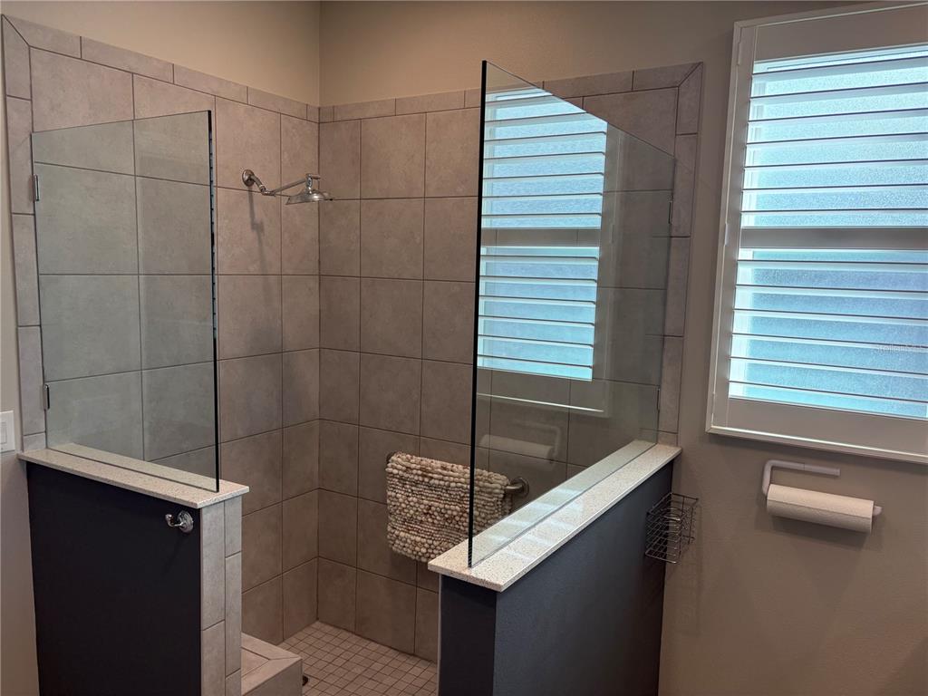 7819 Southwest 88th St Road Ocala, FL 34476 - Photo 15 of 30 a bathroom with a sink and a shower