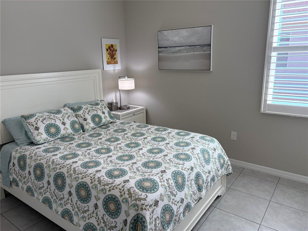 7819 Southwest 88th St Road Ocala, FL 34476 - Photo 16 of 30 a bedroom with a bed and window