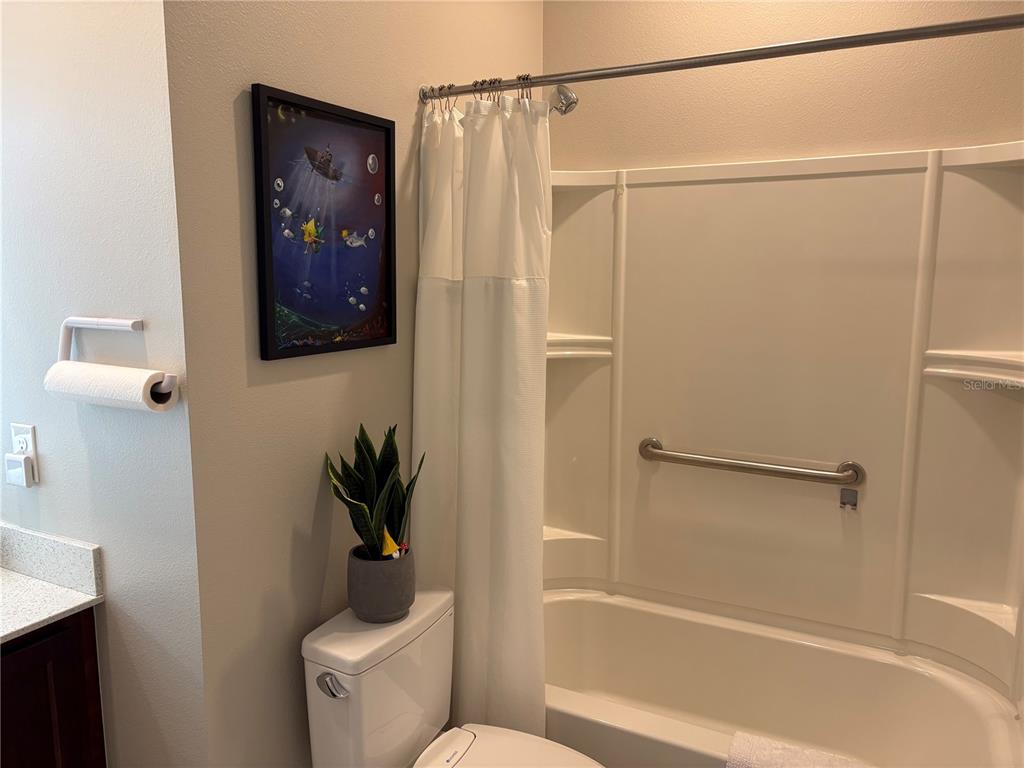 7819 Southwest 88th St Road Ocala, FL 34476 - Photo 17 of 30 a bathroom with a shower and a toilet