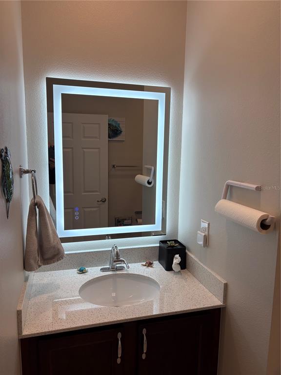 7819 Southwest 88th St Road Ocala, FL 34476 - Photo 18 of 30 a bathroom with a sink vanity and a mirror