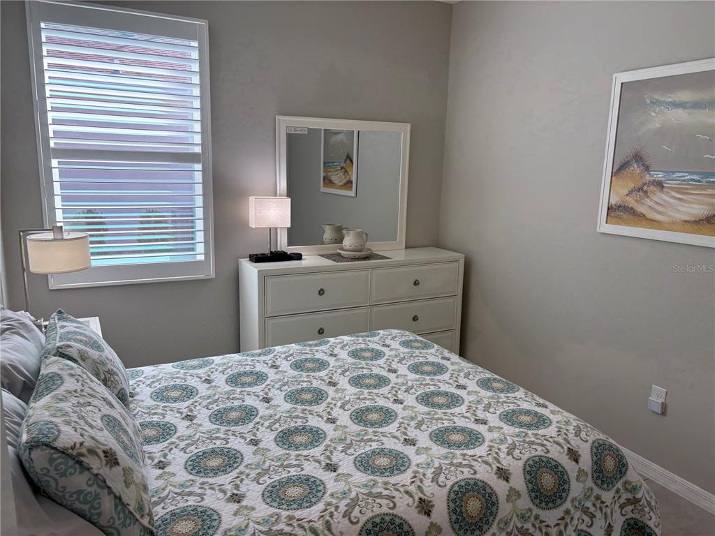 7819 Southwest 88th St Road Ocala, FL 34476 - Photo 19 of 30 a bedroom with a bed and a window