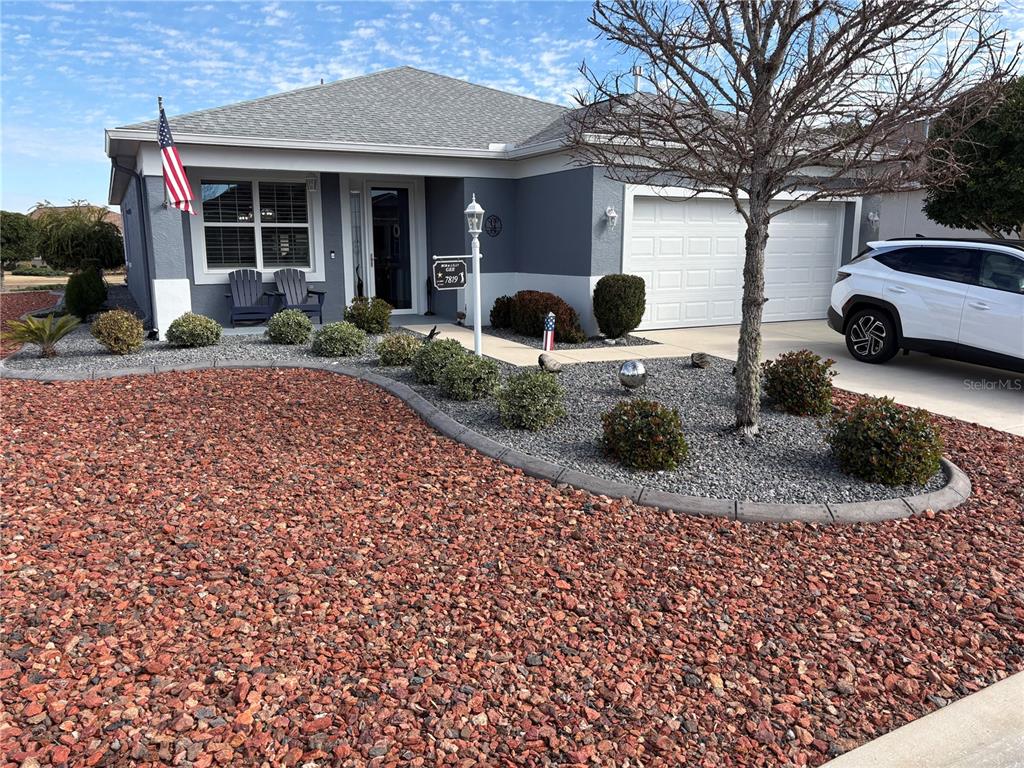 7819 Southwest 88th St Road Ocala, FL 34476 - Photo 2 of 30 a front view of a house with garden