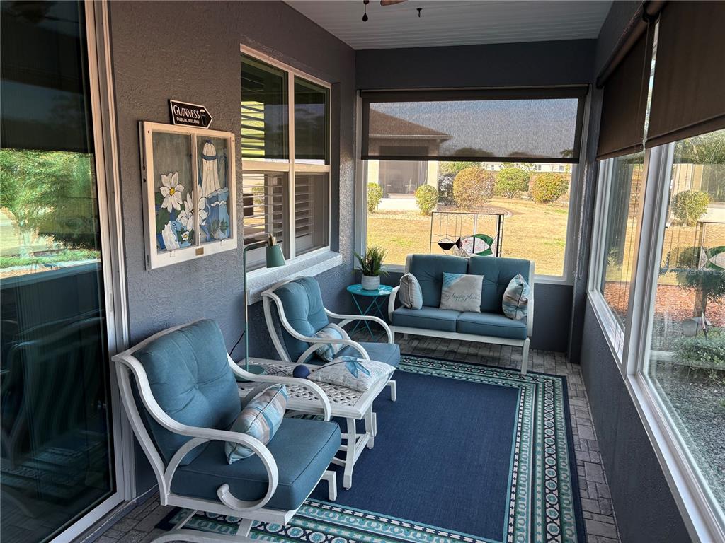 7819 Southwest 88th St Road Ocala, FL 34476 - Photo 22 of 30 a living room with furniture and a large window