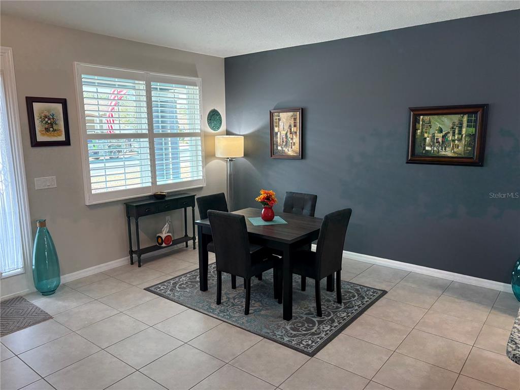 7819 Southwest 88th St Road Ocala, FL 34476 - Photo 7 of 30 a view of a workspace with furniture and a window