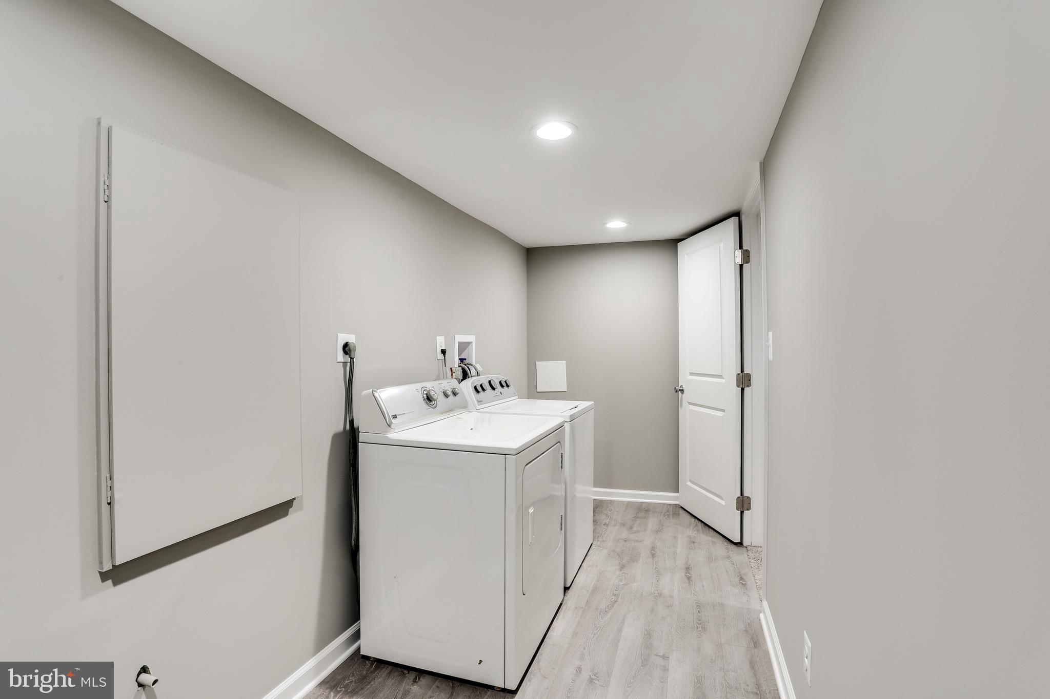 7106 Munford Road Baltimore, MD 21244 - Photo 27 of 31 a view of hallway with washer and dryer