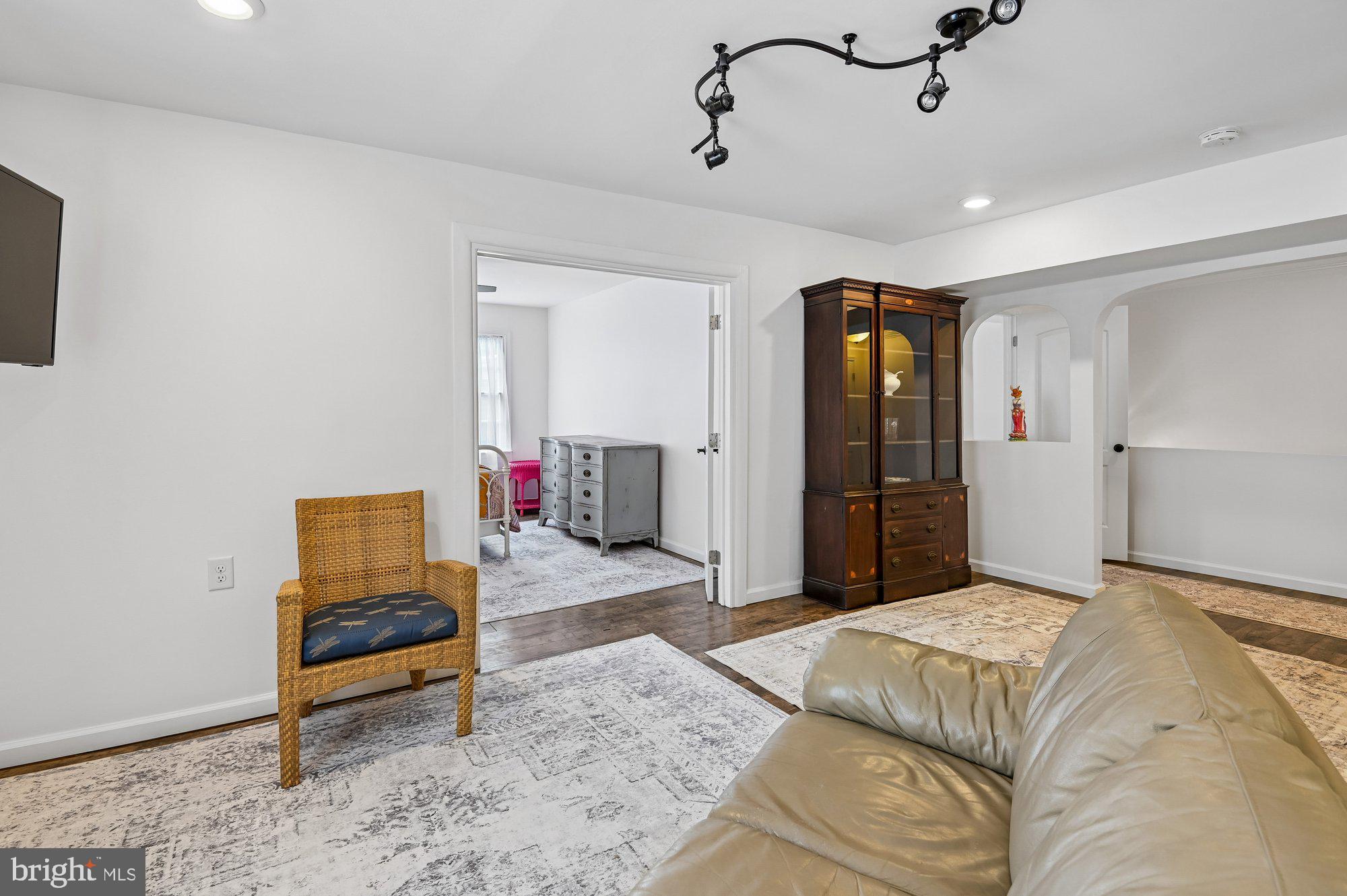 8 Fleet Street Annapolis, MD 21401 - Photo 13 of 37 a bedroom with a bed and a chandelier