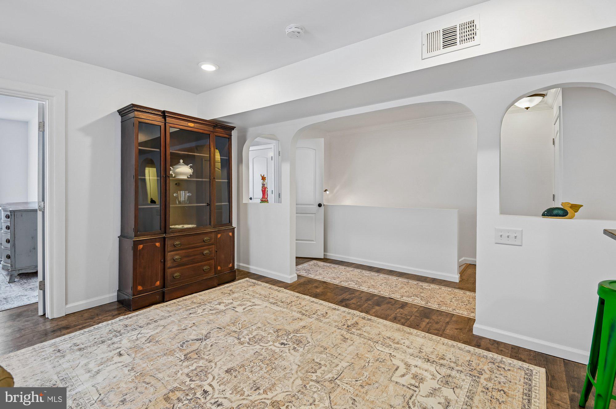 8 Fleet Street Annapolis, MD 21401 - Photo 14 of 37 a view of a livingroom with wooden floor and kitchen space