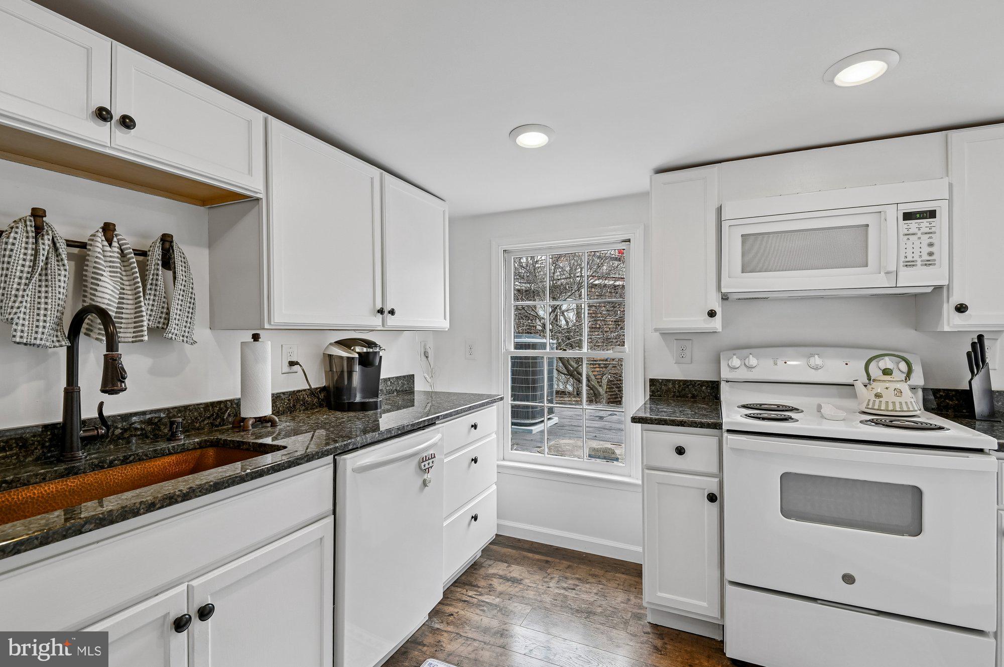 8 Fleet Street Annapolis, MD 21401 - Photo 17 of 37 a kitchen with granite countertop a sink stove and cabinets
