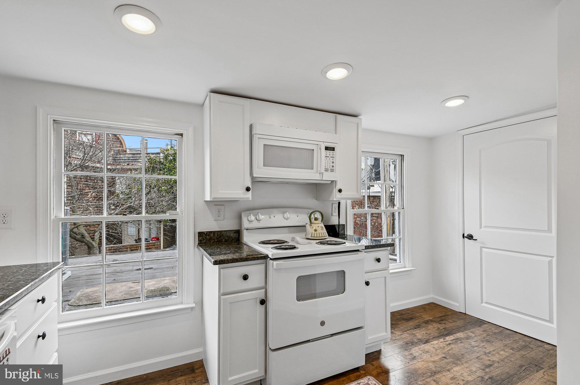 8 Fleet Street Annapolis, MD 21401 - Photo 18 of 37 a kitchen with a stove microwave and refrigerator