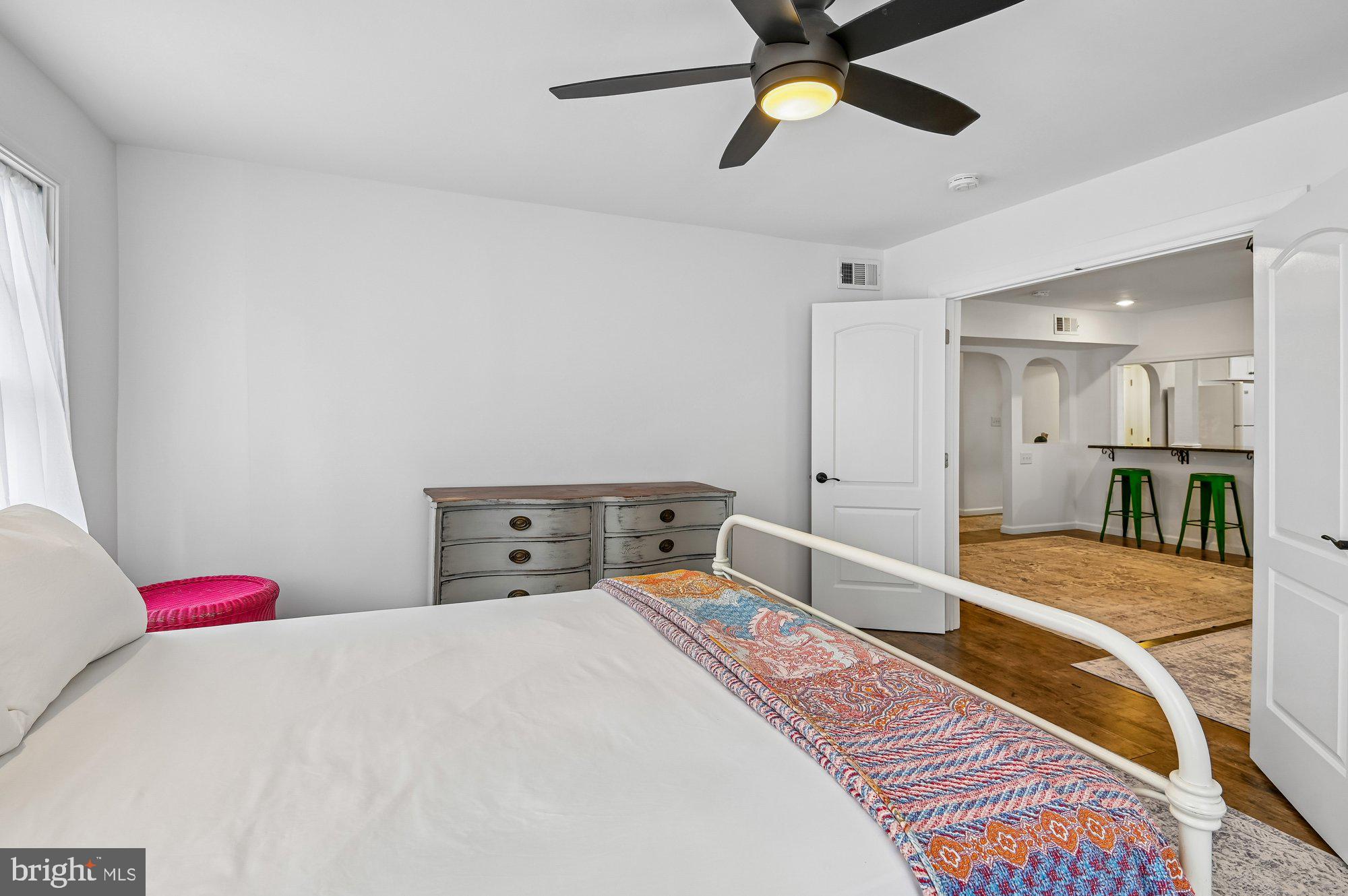 8 Fleet Street Annapolis, MD 21401 - Photo 23 of 37 a bedroom with a bed and a chandelier