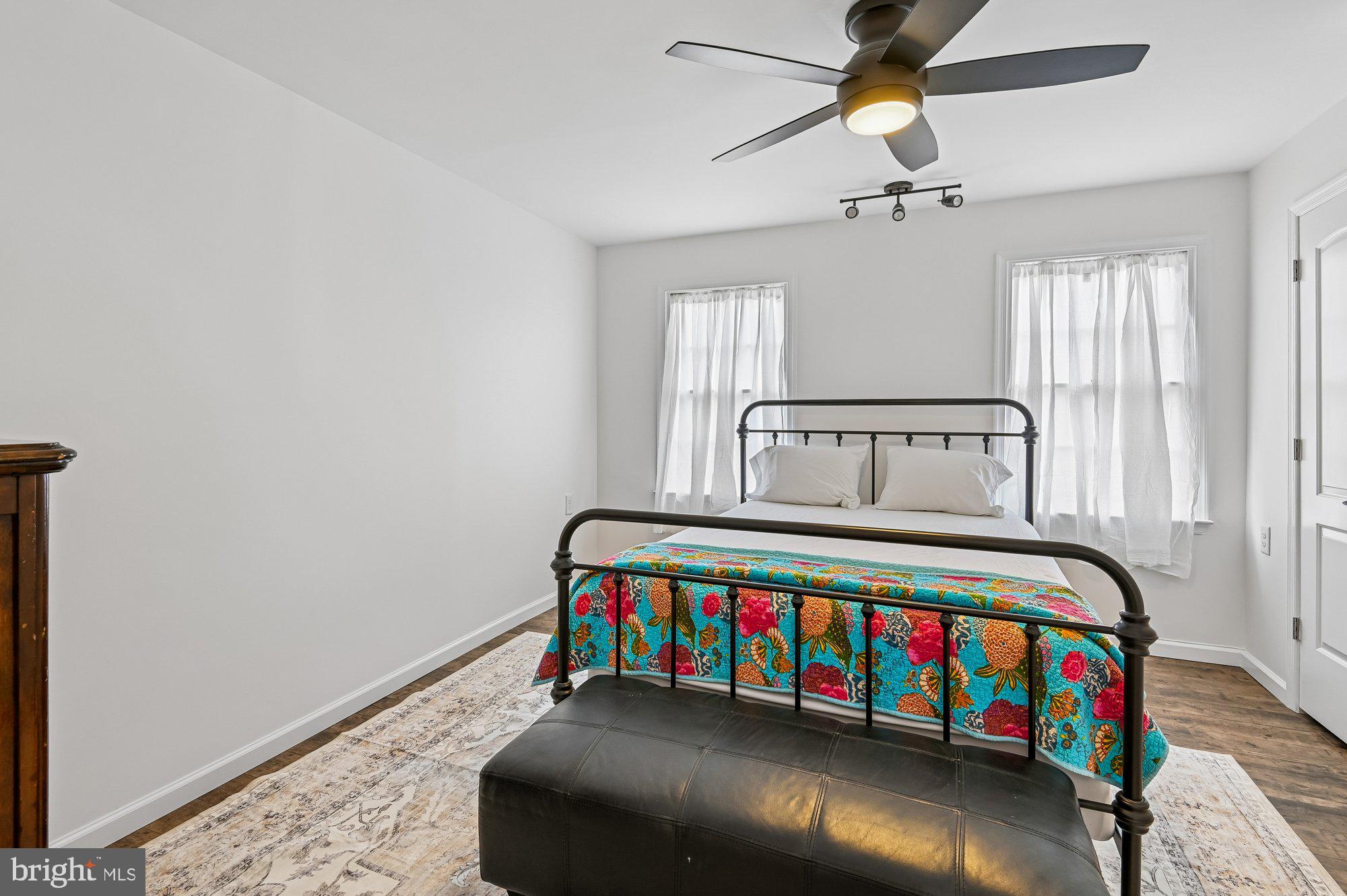 8 Fleet Street Annapolis, MD 21401 - Photo 27 of 37 a bedroom with a bed and wooden floor
