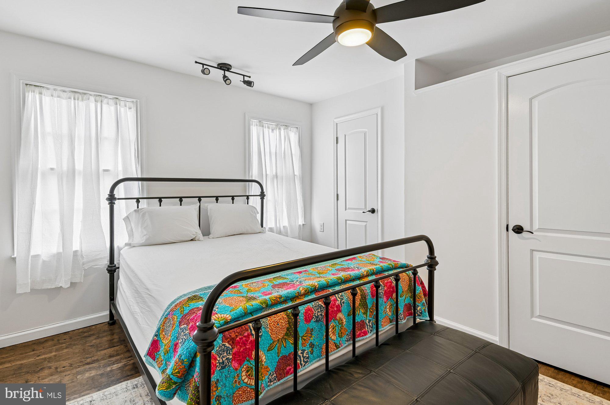 8 Fleet Street Annapolis, MD 21401 - Photo 28 of 37 a bedroom with a bed and a chandelier