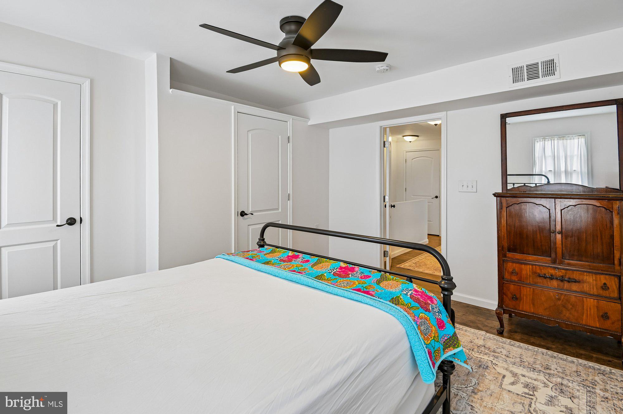 8 Fleet Street Annapolis, MD 21401 - Photo 29 of 37 a bedroom with a bed and a chandelier