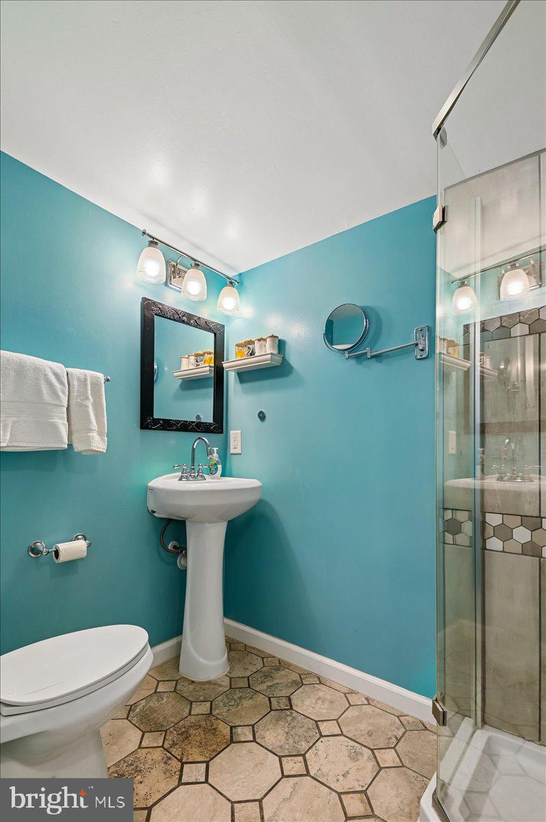 8 Fleet Street Annapolis, MD 21401 - Photo 36 of 37 a bathroom with a toilet sink and mirror