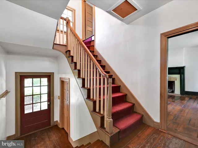 a view of stairs with wooden floor