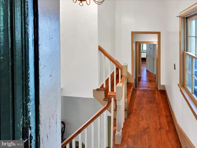 a view of front door with wooden floor