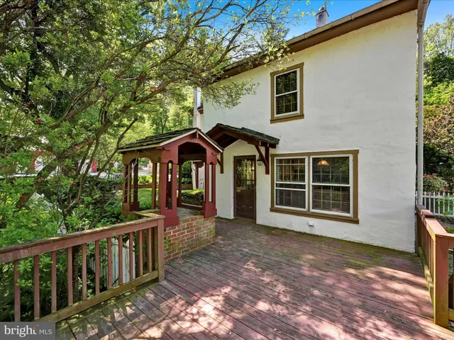 a view of outdoor space with deck and green space